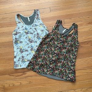 Two racerback tanks with tiny front pocket